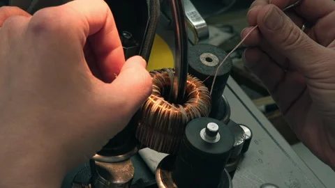 Worker Manually Winds Copper Wire On Coil For Machine Engine Manufacturing Stock Footage 197344574