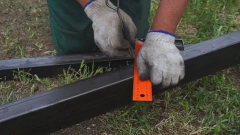 Worker marking lines for metal cutting Stock Footage 310870679
