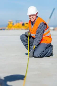Worker measure construction Stock Photos
