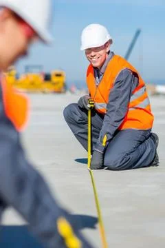 Worker measure construction Stock Photos
