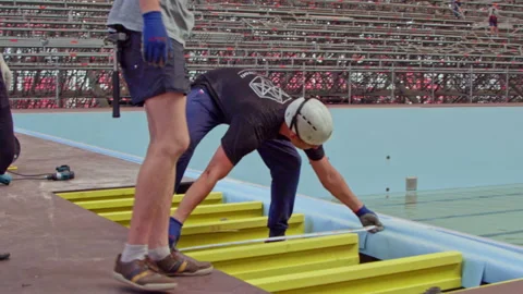 Worker measures distance between swimming pool edge and tile Stock Footage 238936370