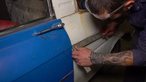 Worker measures the length of the car before cutting Stock Footage 80928406