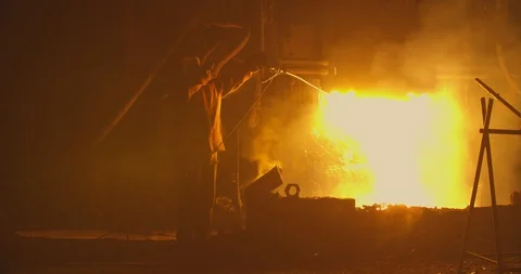 The worker measures the temperature inside the furnace to burst metal Stock Footage 128992274