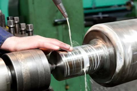 Worker measuring on industrial turning machine. Industry 스톡 사진
