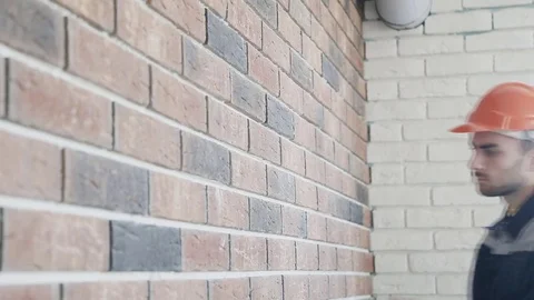A worker measuring a wall with a tape measure Stock Footage 70422568