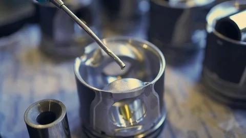 Worker the mechanic installs a new piston.Engine repair. Stock Footage 101326003