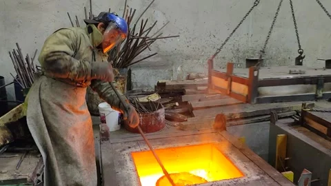 A worker melts metal in the studio of the monument to Alexander Nevsky Stock Footage 157784196