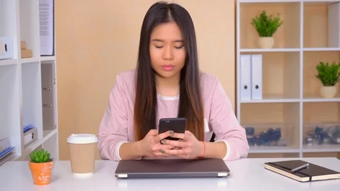 Worker messaging on cellular at the workplace Stock Footage 112088827