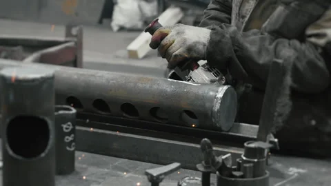 A worker at a metalworking plant processes metal. Stock Footage 306540306