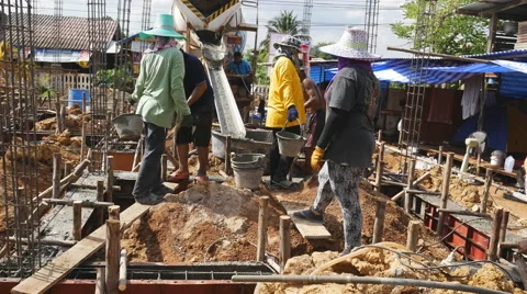 Worker mixed concrete pouring to construction beam Stock Footage 58370202