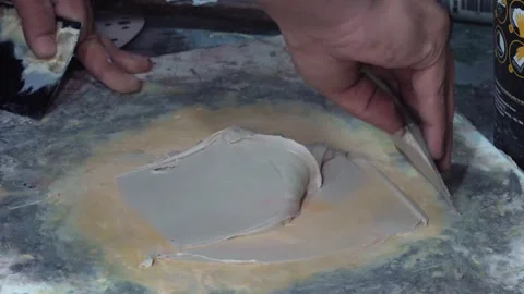Worker Mixing And Spreading Putty On Surface In Workshop 스톡 동영상 332058133