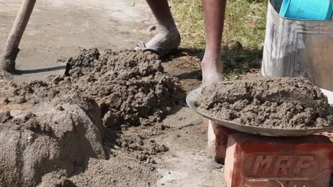 Worker Mixing Sand and Cement 스톡 동영상 336435529