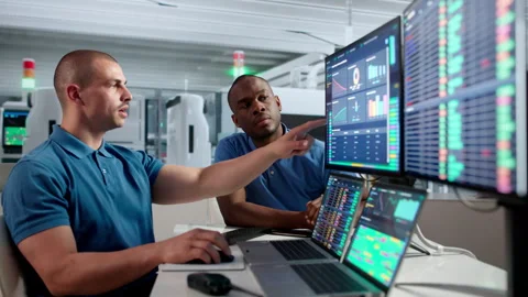 Worker Monitors Industrial Automation System On Computers Stock Footage 334922499