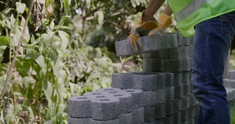 Worker move huge brick to stacking at the construction site Stock Footage 159051219