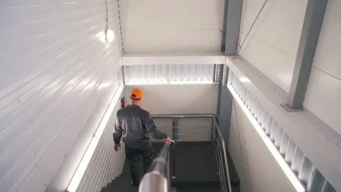 A worker moves around the warehouse Stock Footage 145693370