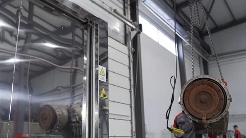 Worker moves heavy detail using the remote controller close up 库存影片 129639664