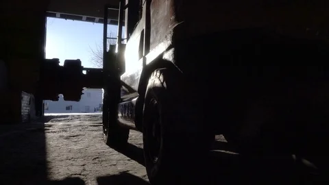 Worker moves a huge part with a telpher. Diesel Forklift Truck leaves the Stock Footage 75150895