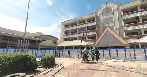 Worker moving wet-process bored pile machine for outside construction Stock Footage 91878033