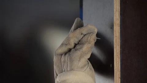 Worker nailing on the wall Stock Footage 70094970