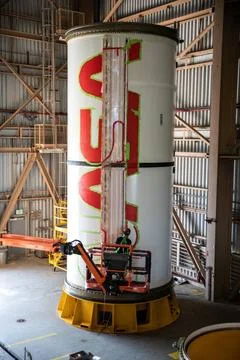 A worker with NASAs Exploration Ground Systems (EGS) finishes the first c.. Fotos de archivo