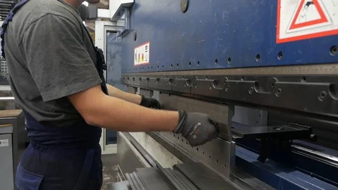 Worker near the machine at the factory Stock Footage 94042174