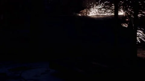 Worker at night is cutting rusty metalwork with oxy-fuel gas cutting torch. Stock-Footage 145992075