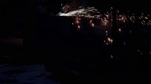 Worker at night is cutting rusty metalwork with oxy-fuel gas cutting torch. Stock Footage 145992093