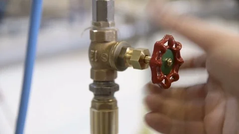 Worker opening a crane in a factory Stock Footage 81809813