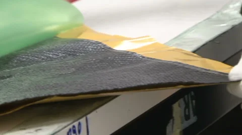 Worker opening new slice of carbon fibre Stock Footage 37090569