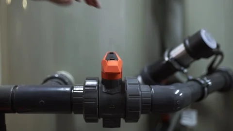 The worker opens the valve on the pipe and starts the sewage treatment process Stock Footage 92590018