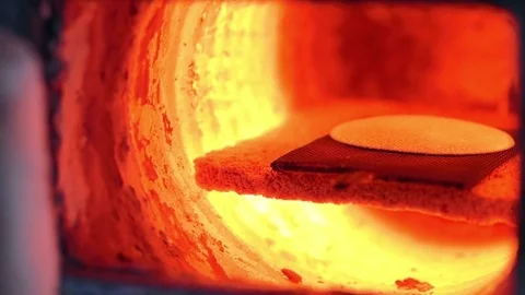 Worker opens valve red-hot fiery furnace and pulls out from there red of Vídeos de archivo 71810113