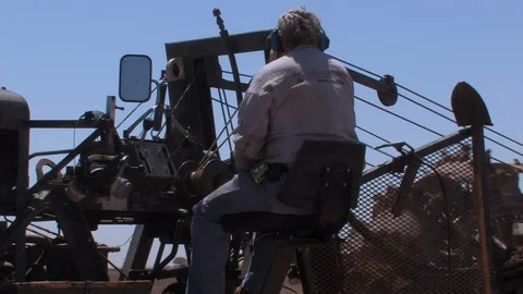 Worker operates a Ditch Witch in a Texas cotton field. Stock Footage 88681578