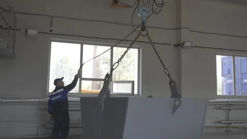 Worker operates huge mechanised bucket at industrial plant Stock Footage 267685403
