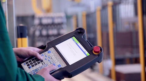 Worker operates with Robotic Arm Loading... | Stock Video | Pond5
