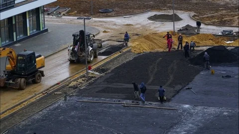 Worker operating asphalt paver machine during road construction and repairing Stock Footage 82211102