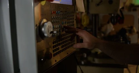 Worker operating a control board in a chocolate factory Stock Footage 103999088