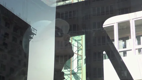 Worker operating a crane at a construction site Stock-Footage 89872973