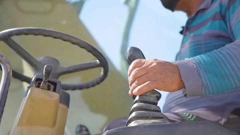 Worker operating excavator at construction site 스톡 동영상 171668982