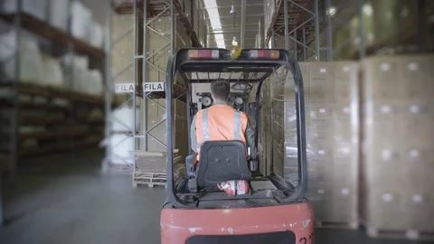 Worker operating forklift truck Stock Footage 106292359