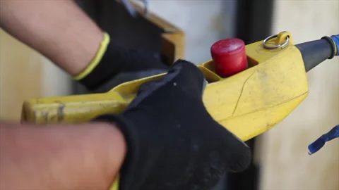 Worker operating hoist control during construction work Stock Footage 317254188