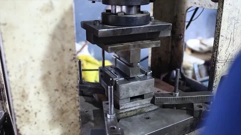 Worker Operating a Hydraulic Stamping Press in a Metal Fabrication Factory Stock Footage 320222147