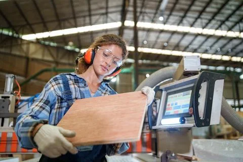 Worker Operating Industrial Woodworking Machine in Factory Stock Photos