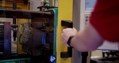 Worker Operating Injection Molding Machine, Open Steel Tool, Factory Shot Stock Footage 340644342