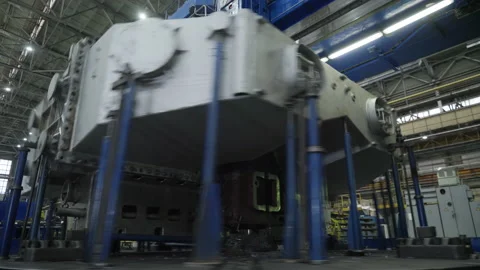 A Worker is Operating A Large Lathe. A Part of the Lathe is Rapidly Rotating. Video stock 150258951