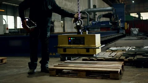Worker Operating Lifting Magnet in Steel Factory Hall, Industrial Wide Shot Stock Footage 341528978