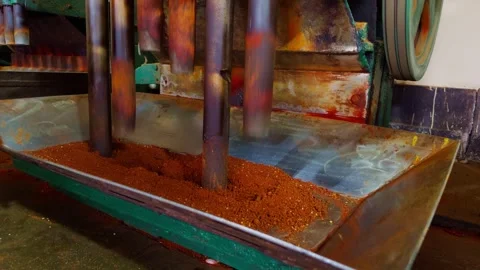 Worker operating machinery for grinding red chilli processing chilli powder.. Stock-Footage 264939021