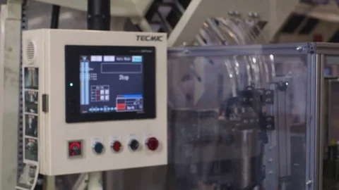 Worker operating PLC electronic controller interface in factory Stock Footage 85186503