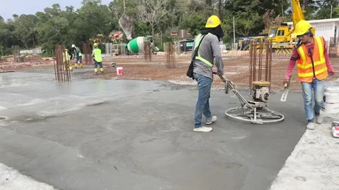 Worker Operating Power Float Machine to Finish Fresh Concrete Floor Stock Footage 344562103