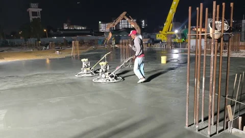 Worker Operating Power Float Machine to Finish Fresh Concrete Floor Stock Footage 344562208
