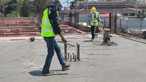 Worker Operating Power Float Machine to Finish Fresh Concrete Floor Stock Footage 344562346